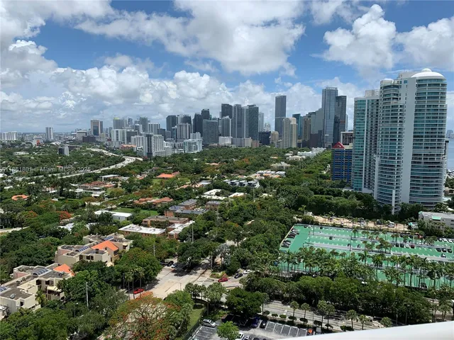 a view of a city with lots of plants and trees