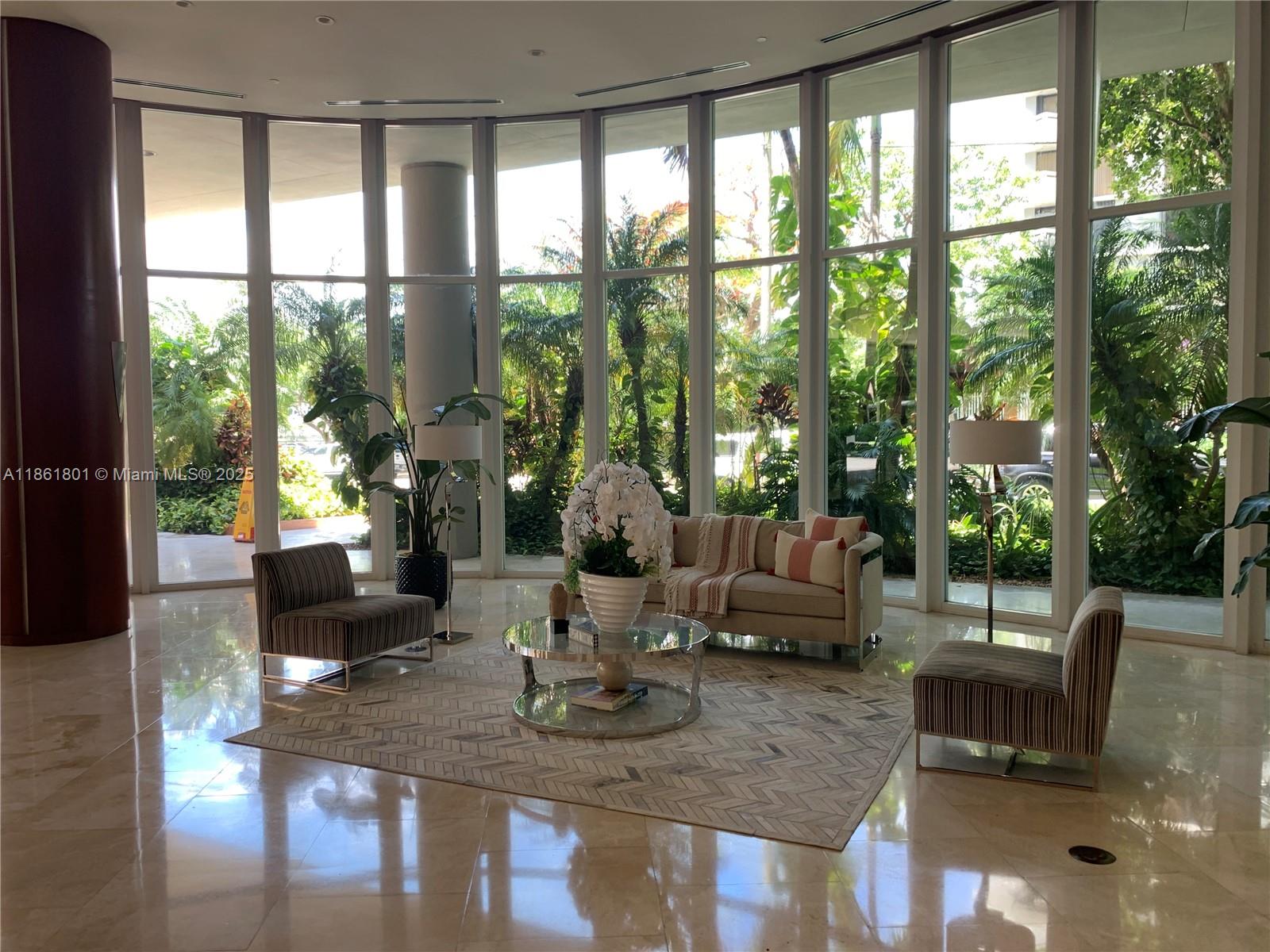 2475 Brickell Avenue, Unit 2504 Miami, FL 33129 - Photo 14 of 32 a living room with furniture and a large window