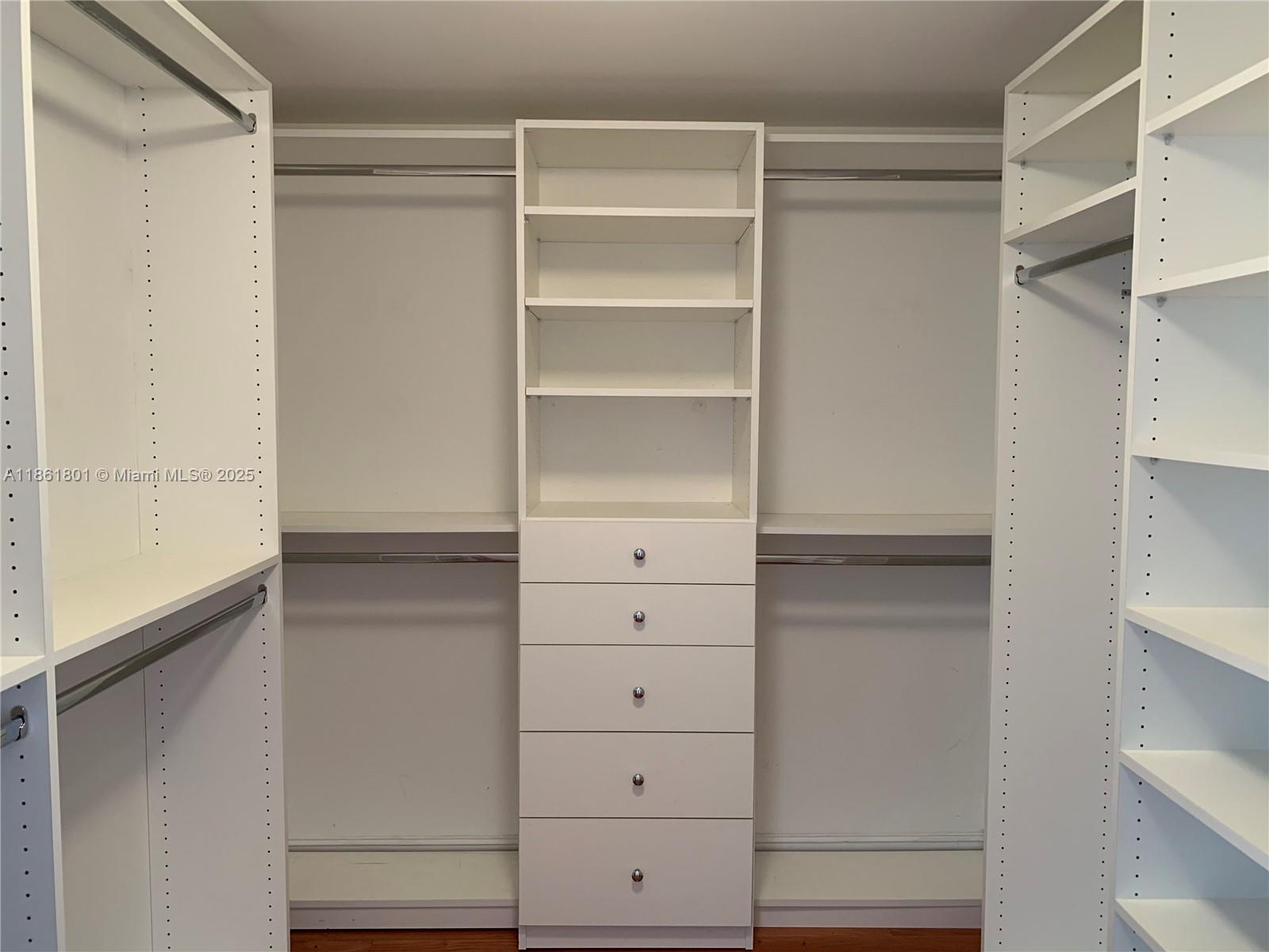 2475 Brickell Avenue, Unit 2504 Miami, FL 33129 - Photo 21 of 32 a view of walk in closet with empty racks