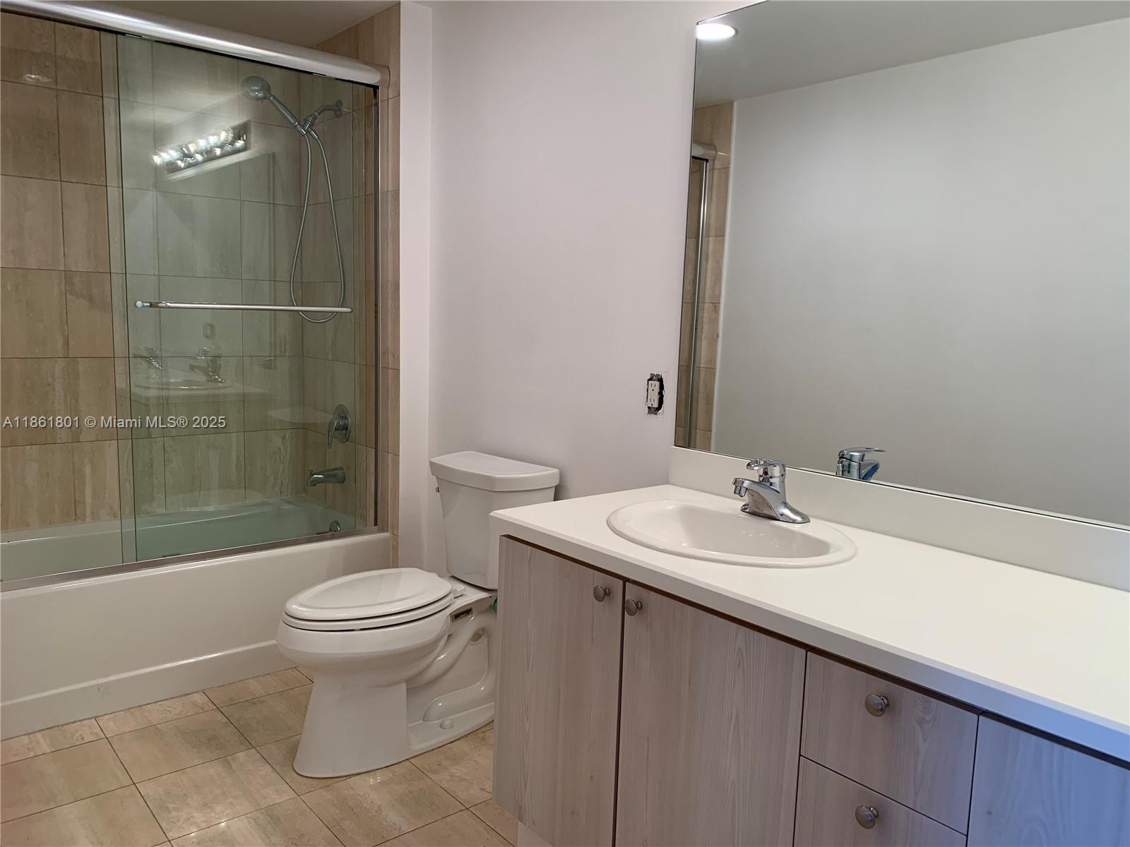 2475 Brickell Avenue, Unit 2504 Miami, FL 33129 - Photo 22 of 32 a bathroom with a sink toilet and shower