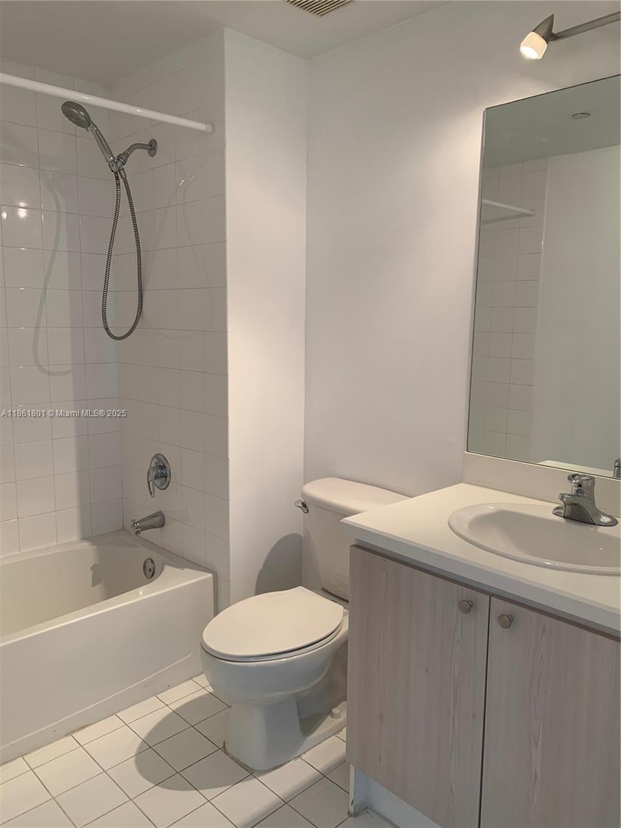 2475 Brickell Avenue, Unit 2504 Miami, FL 33129 - Photo 31 of 32 a bathroom with a sink a toilet and a bathtub