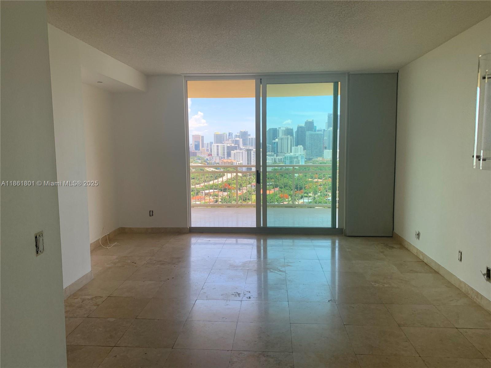 2475 Brickell Avenue, Unit 2504 Miami, FL 33129 - Photo 32 of 32 wooden floor in an empty room with a window