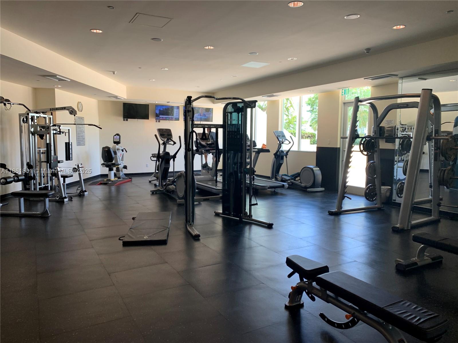 2475 Brickell Avenue, Unit 2504 Miami, FL 33129 - Photo 4 of 32 a view of a room with gym equipment
