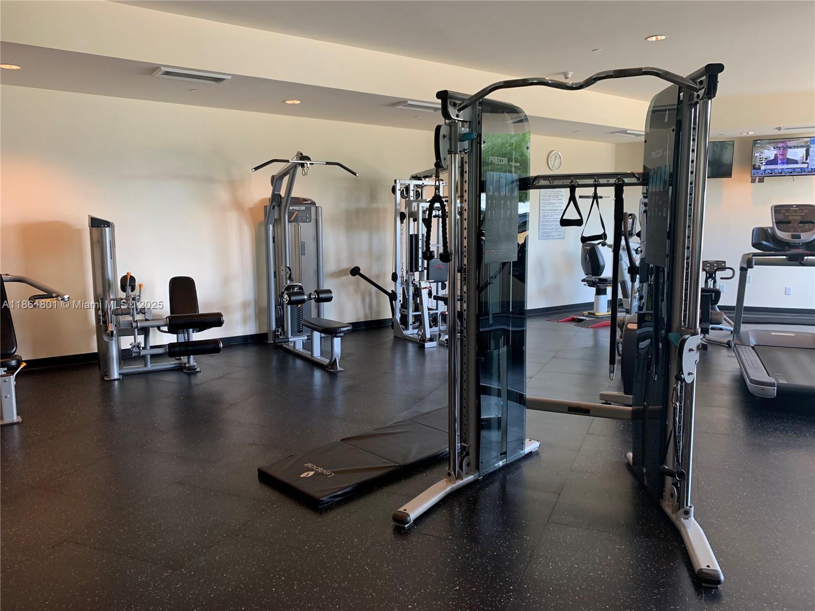 2475 Brickell Avenue, Unit 2504 Miami, FL 33129 - Photo 6 of 32 a view of a room with gym equipment
