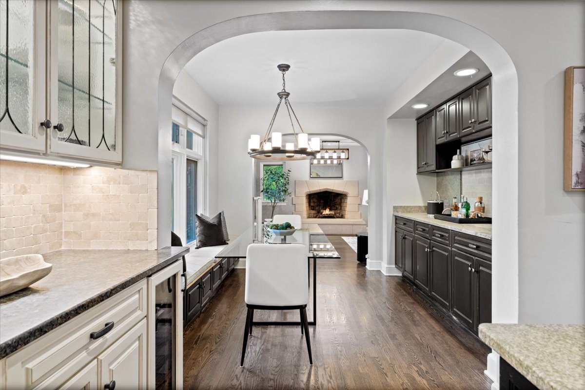 2951 Colfax Street Evanston, IL 60201 - Photo 21 of 62 a living room with stainless steel appliances granite countertop furniture a fireplace a flat screen tv and a window