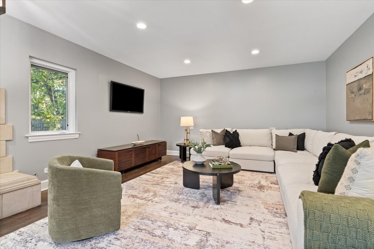 2951 Colfax Street Evanston, IL 60201 - Photo 26 of 62 a living room with furniture and a flat screen tv