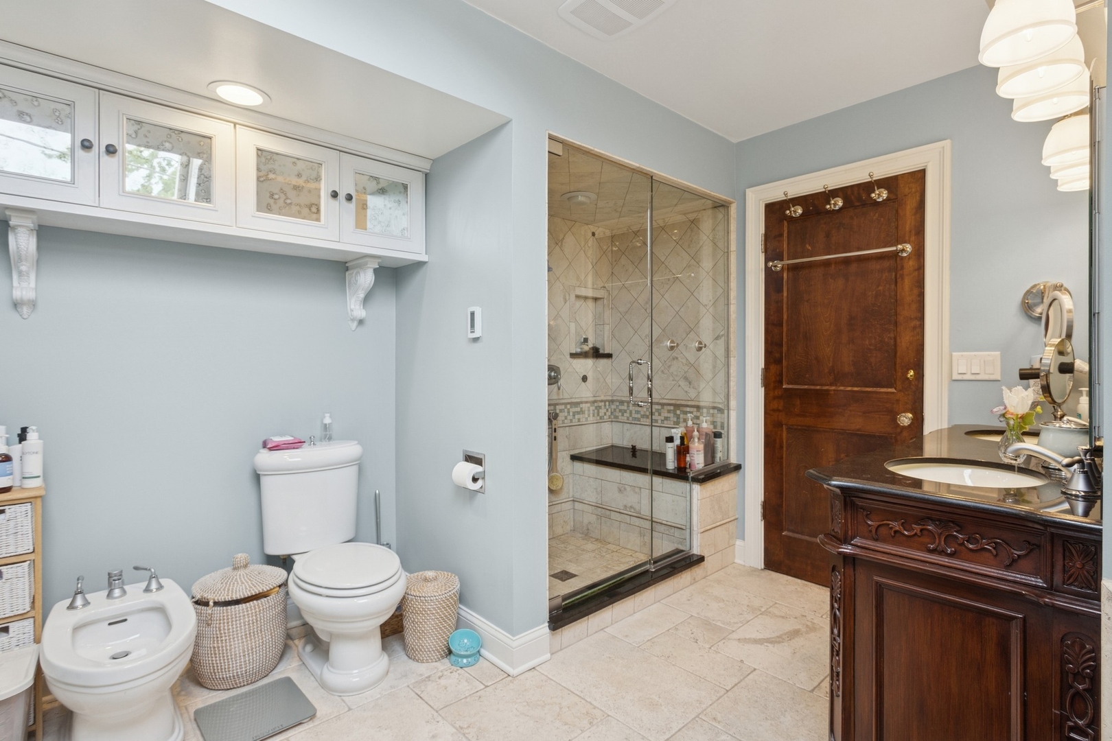2951 Colfax Street Evanston, IL 60201 - Photo 44 of 62 a bathroom with a toilet a sink and a large mirror