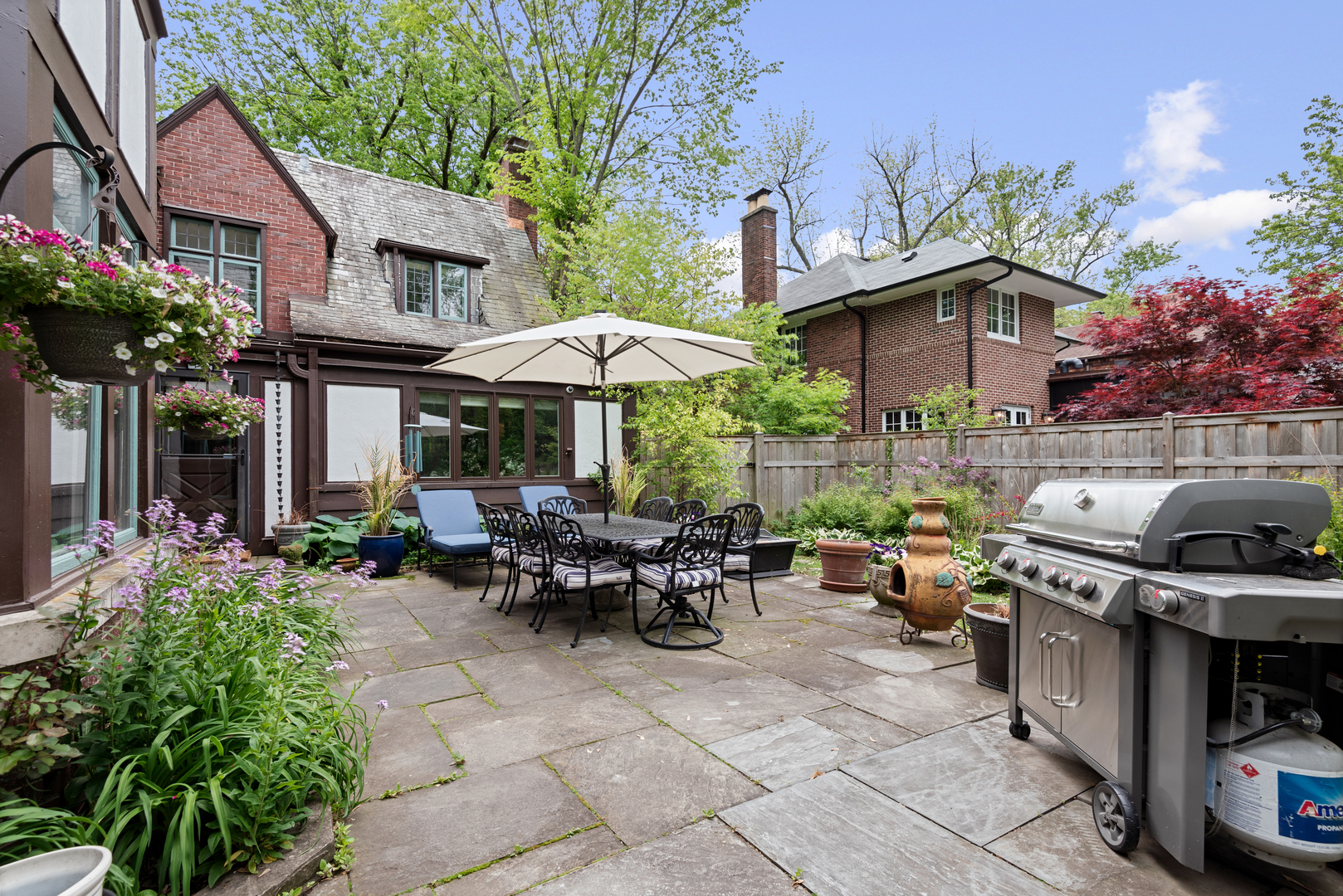 2951 Colfax Street Evanston, IL 60201 - Photo 53 of 62 a view of a chairs and table in the back yard of the house
