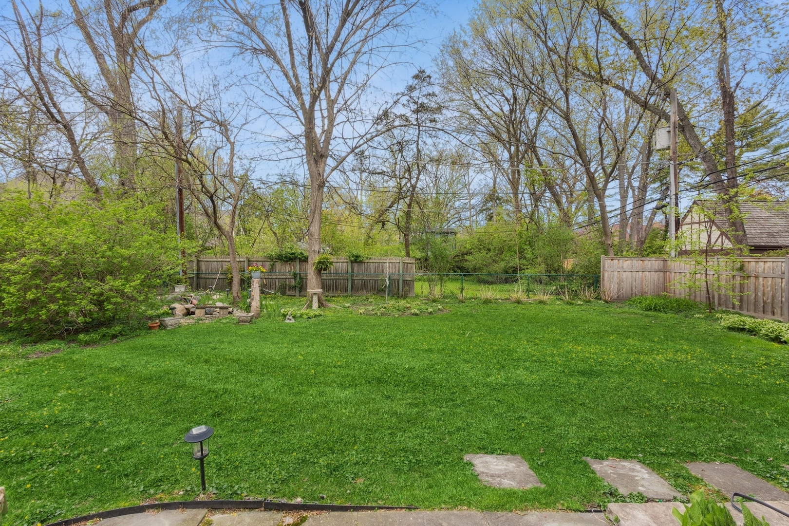 2951 Colfax Street Evanston, IL 60201 - Photo 56 of 62 a backyard of a house with lots of green space