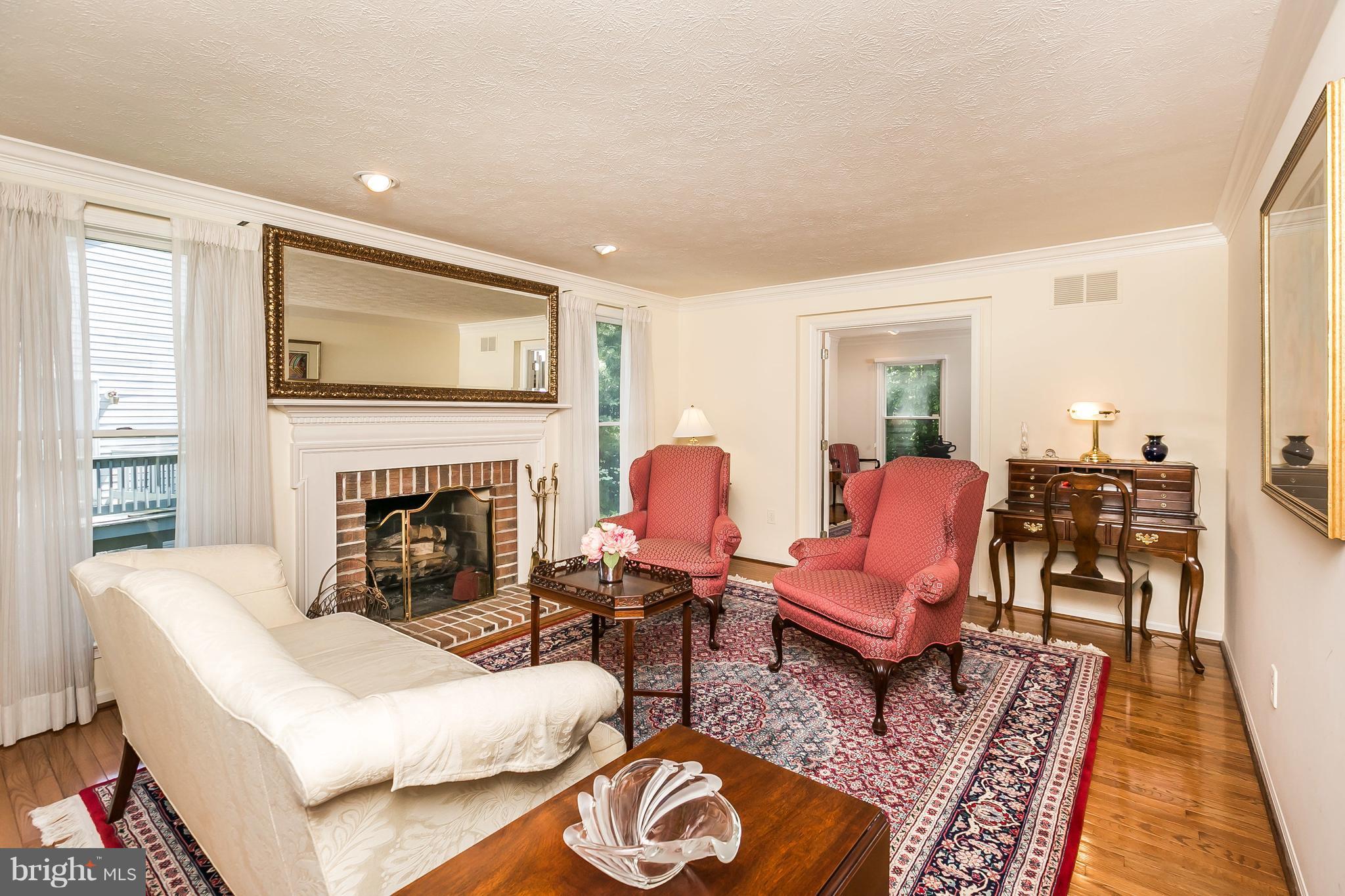 7523 Stream Crossing Road Baltimore, MD 21209 - Photo 5 of 30 LIVING ROOM W/ FIREPLACE & HARDWOOD FLOORS