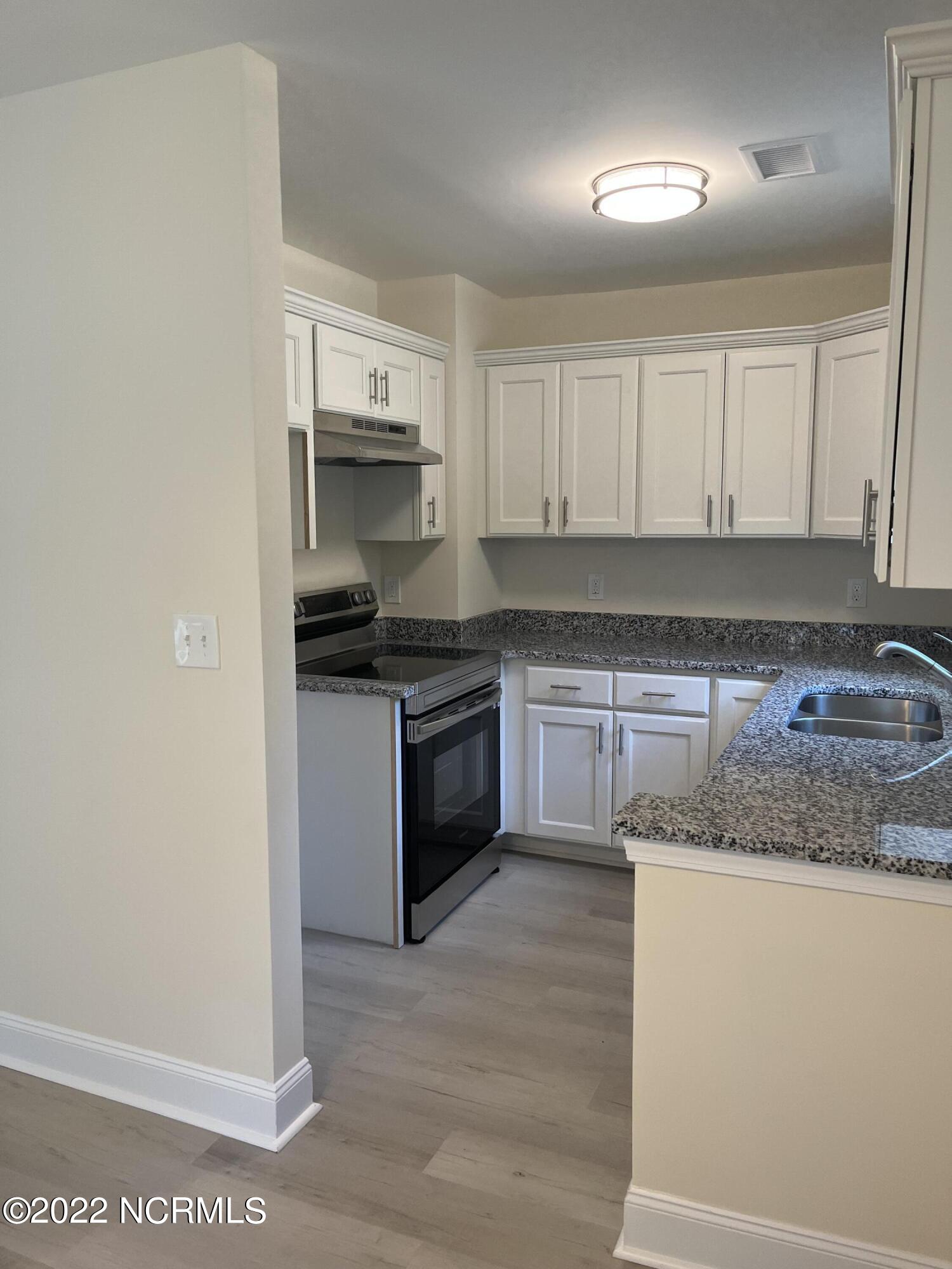 2036 Sloop Point Loop Road, Unit A10 Hampstead, NC 28443 - Photo 5 of 8 Kitchen