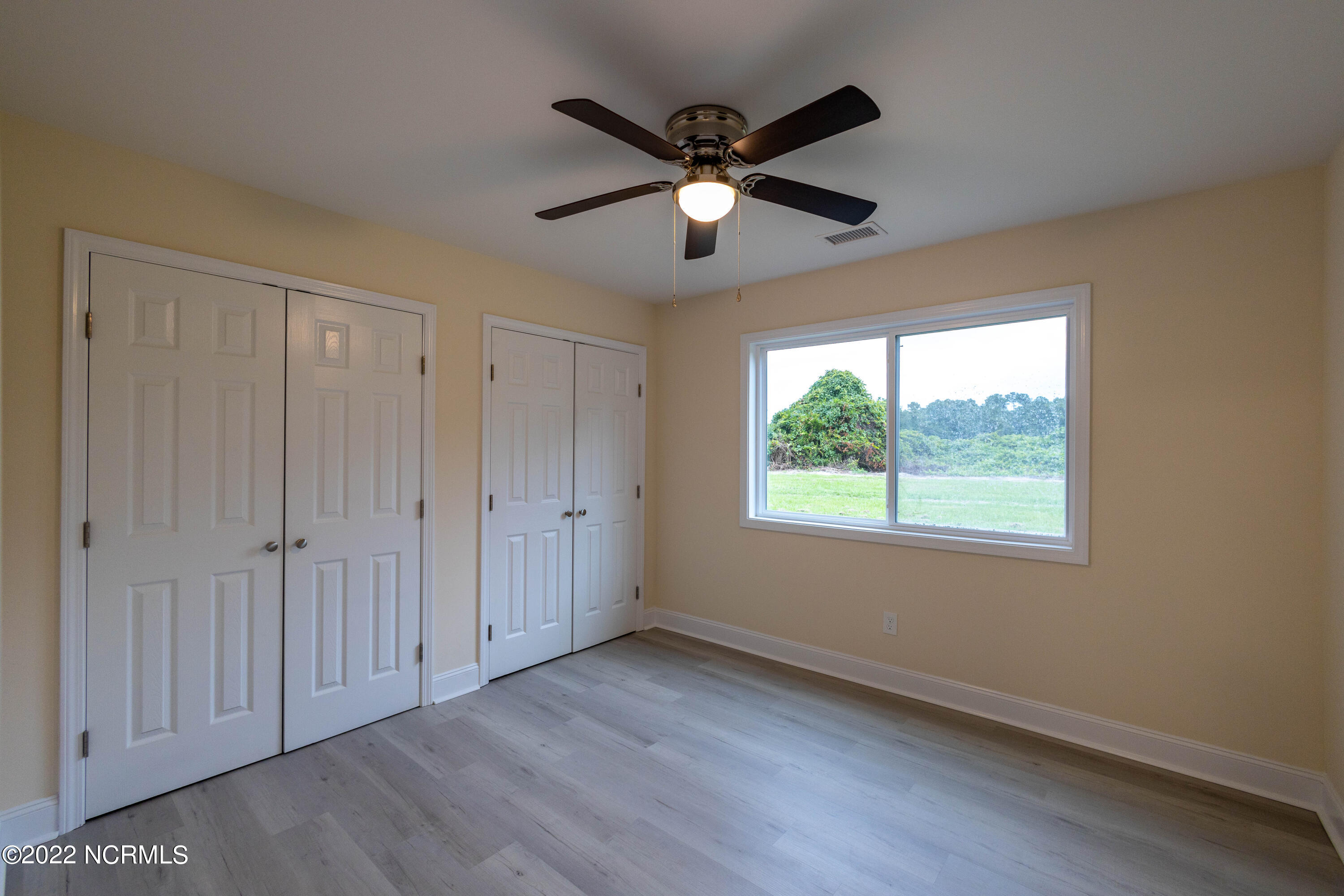 2036 Sloop Point Loop Road, Unit A10 Hampstead, NC 28443 - Photo 7 of 8 Master Bedroom