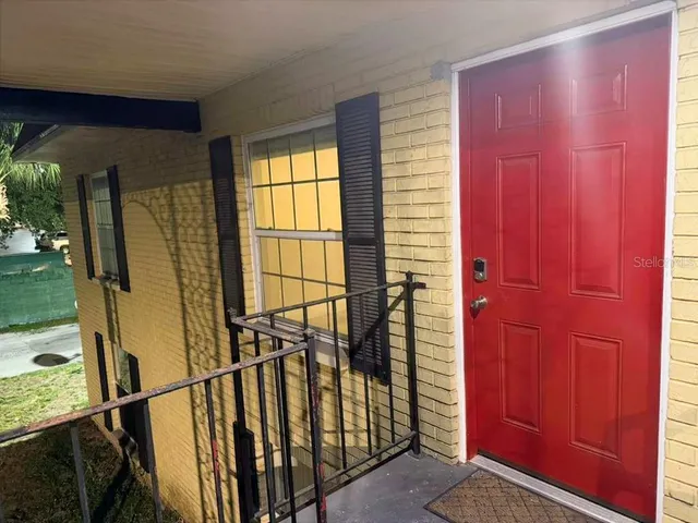 a view of entryway with a door and wooden floor