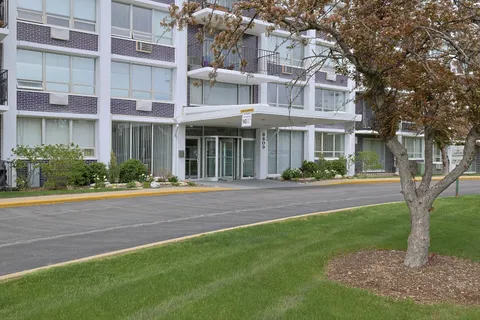 front view of a building with a yard