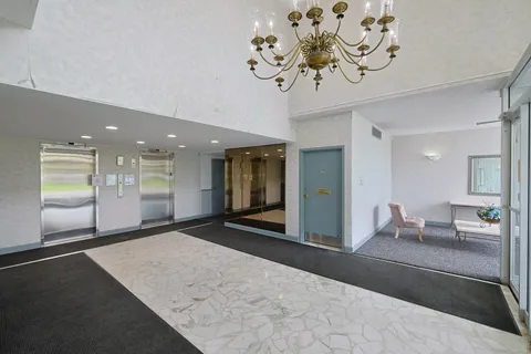 a lobby with a chandelier