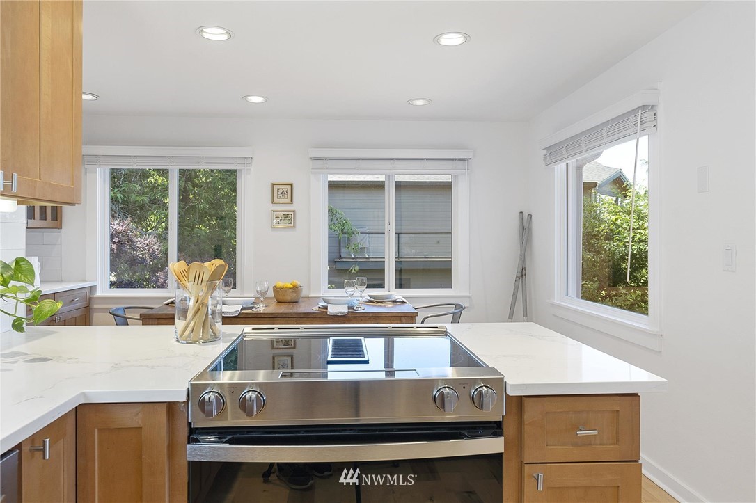 4411 Sunset Beach Road West University Place, WA 98466 - Photo 13 of 39 a view of a kitchen with a stove and a window