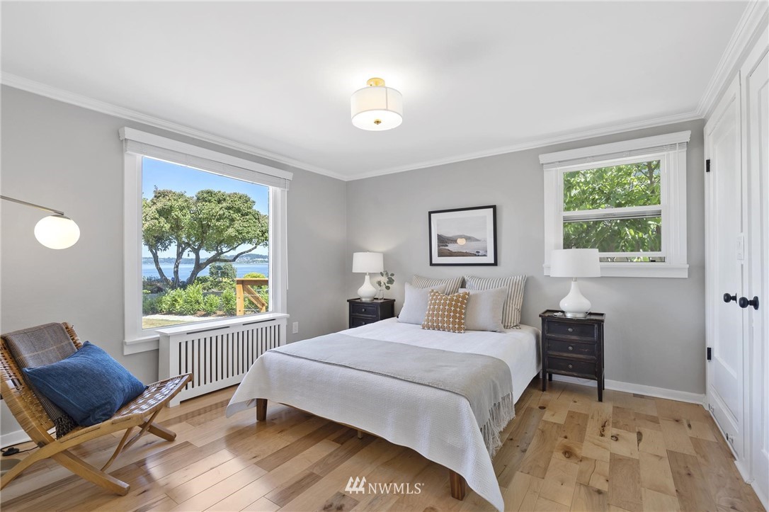 4411 Sunset Beach Road West University Place, WA 98466 - Photo 15 of 39 a bedroom with a bed and a window