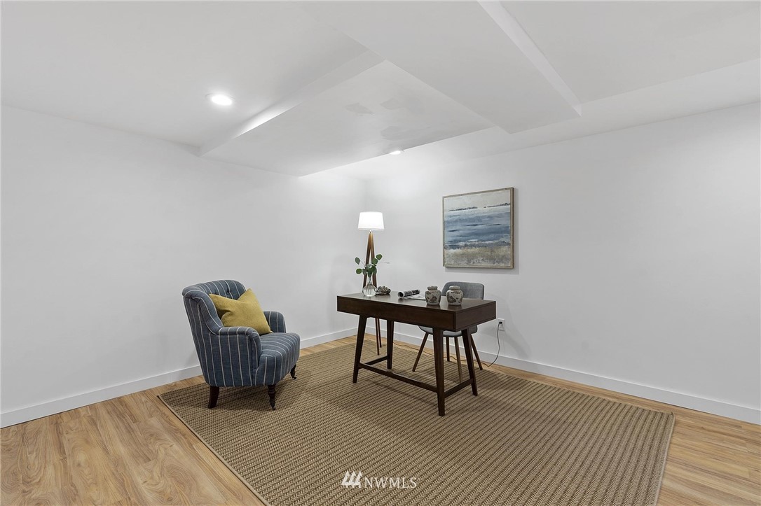 4411 Sunset Beach Road West University Place, WA 98466 - Photo 22 of 39 a view of workspace room with wooden floor outdoor seating and hardwood