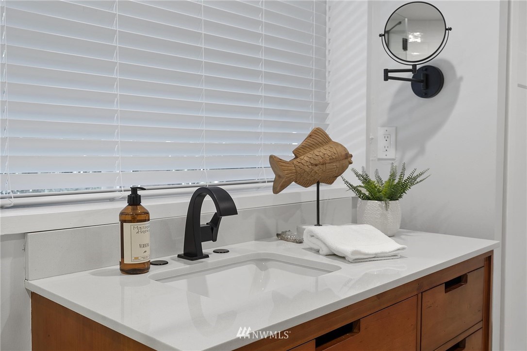 4411 Sunset Beach Road West University Place, WA 98466 - Photo 25 of 39 a kitchen with a sink and a potted plant