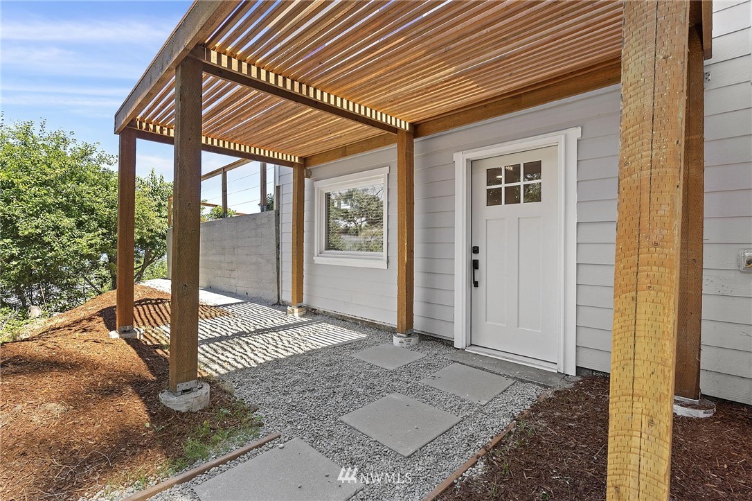 4411 Sunset Beach Road West University Place, WA 98466 - Photo 27 of 39 a porch with view of outdoor space