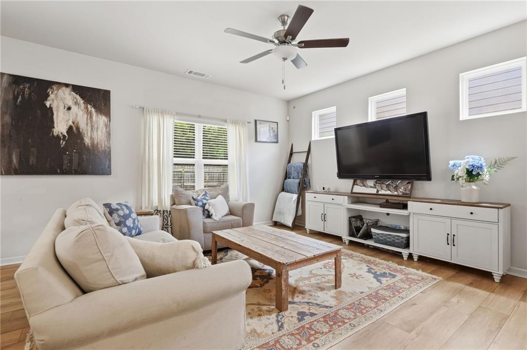 123 Renford Road Ball Ground, GA 30107 - Photo 5 of 27 a living room with furniture and a flat screen tv