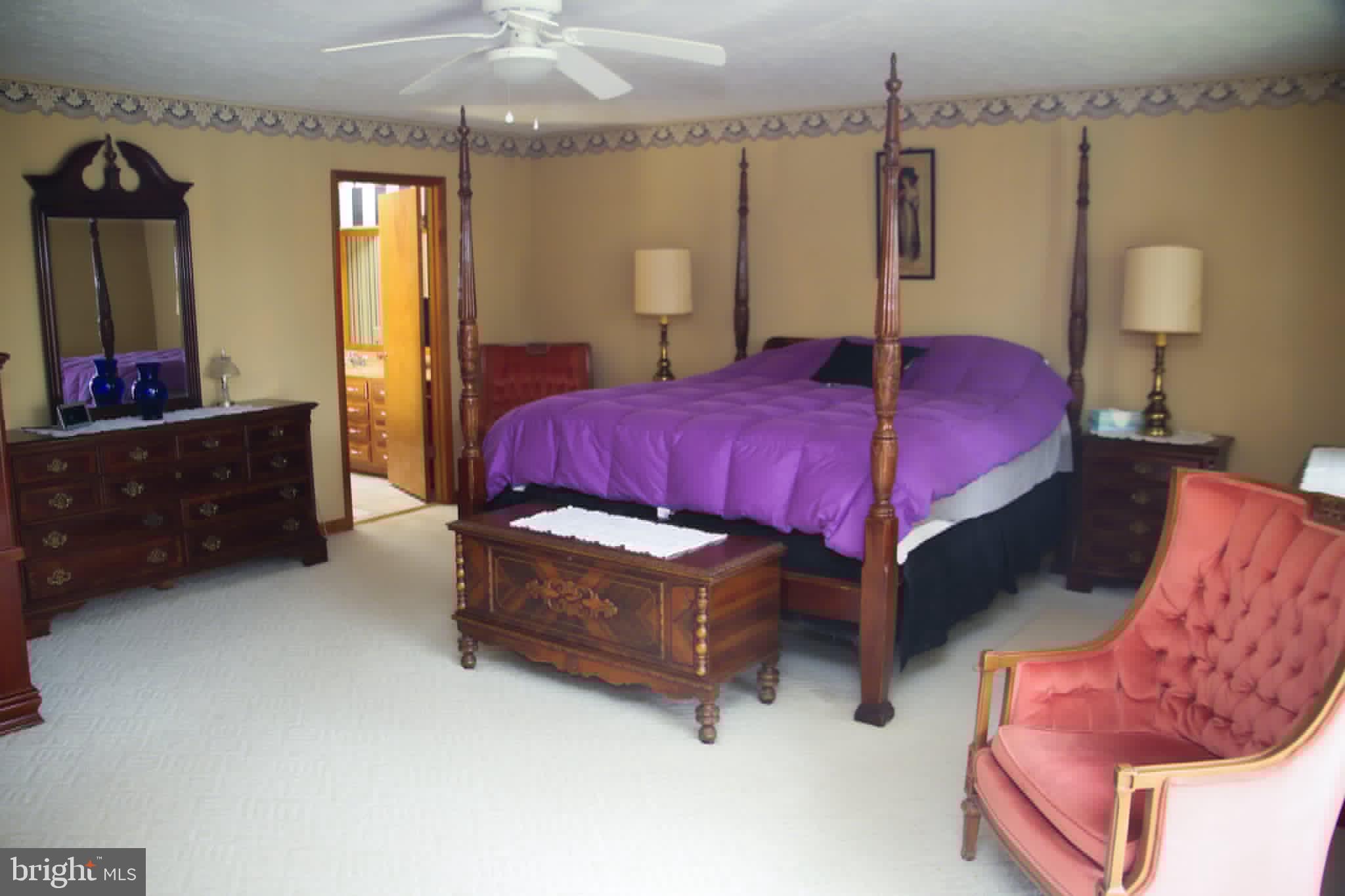1740 Old Crellin Road Oakland, MD 21550 - Photo 13 of 28 a bedroom with a bed mirror and window