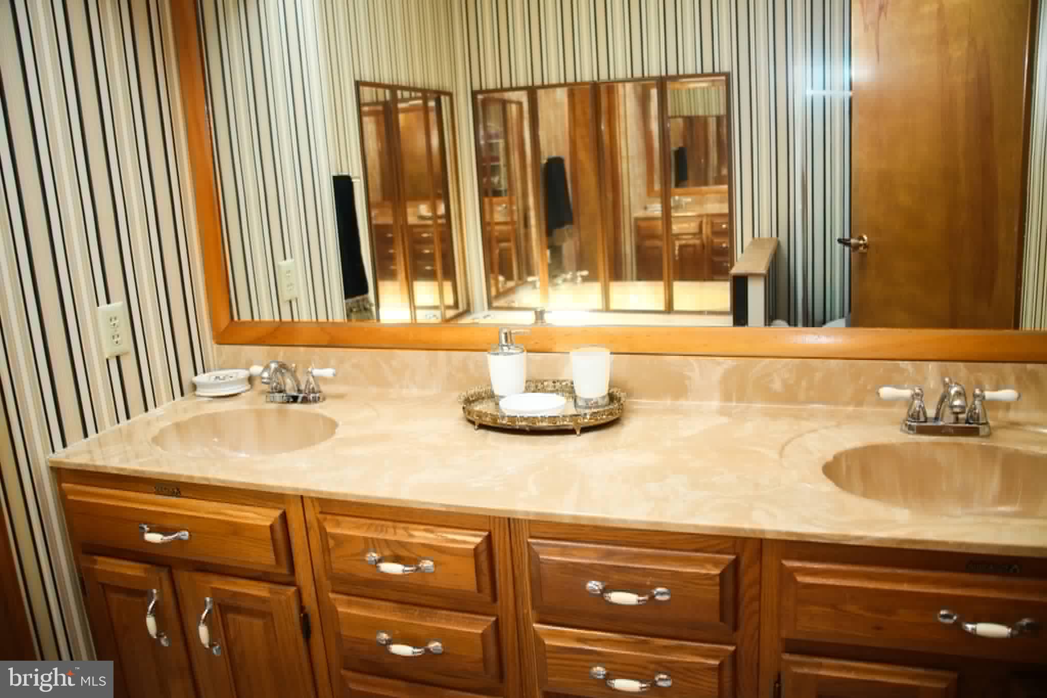 1740 Old Crellin Road Oakland, MD 21550 - Photo 14 of 28 a bathroom with a sink and a mirror