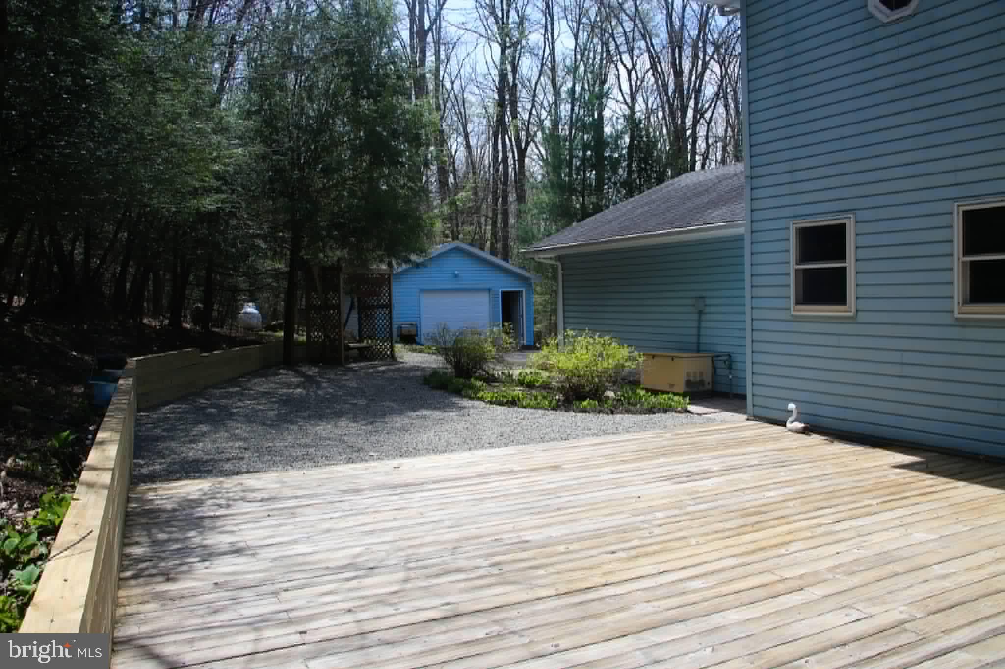 1740 Old Crellin Road Oakland, MD 21550 - Photo 2 of 28 a front view of a house with a yard