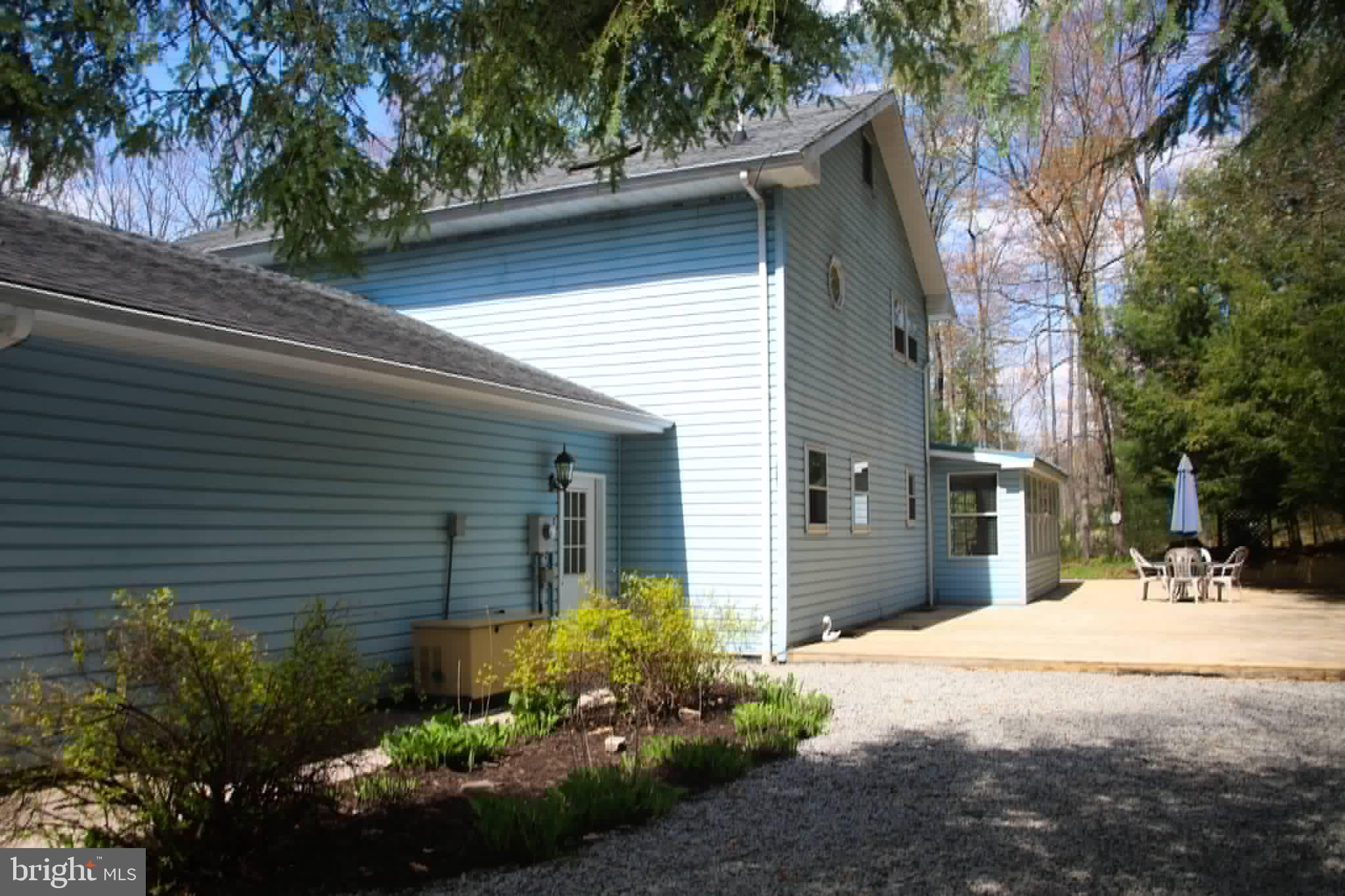 1740 Old Crellin Road Oakland, MD 21550 - Photo 26 of 28 a front view of a house with a yard and outdoor seating
