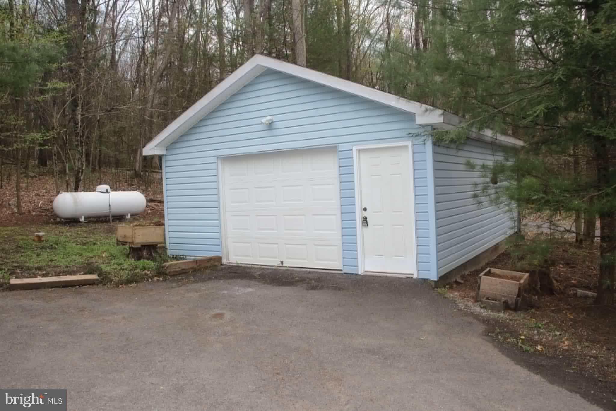 1740 Old Crellin Road Oakland, MD 21550 - Photo 28 of 28 a view of a house with a yard and garage