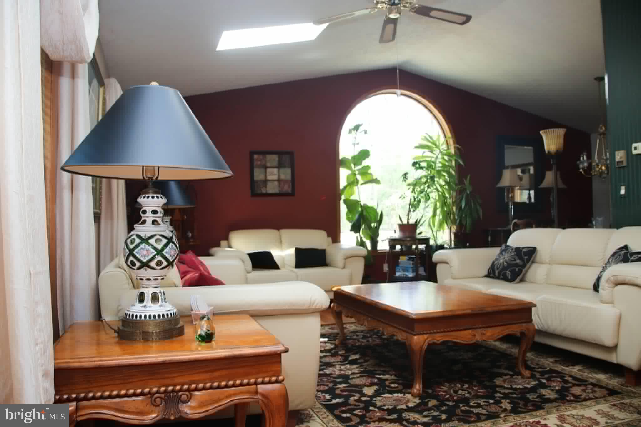 1740 Old Crellin Road Oakland, MD 21550 - Photo 9 of 28 a living room with furniture a chandelier and a large window