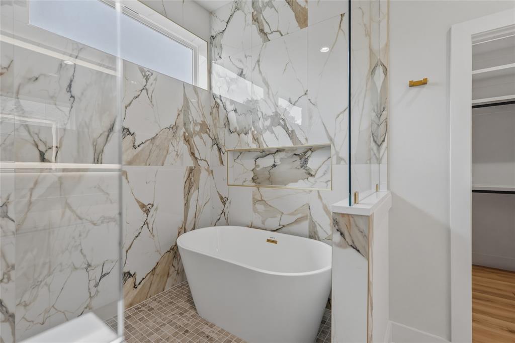 3914 Harlingen Street Dallas, TX 75212 - Photo 22 of 28 a bathroom with a bathtub and shower