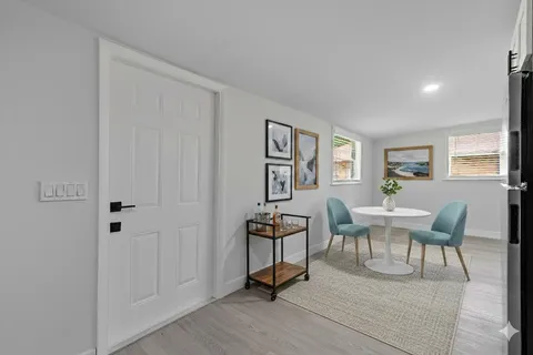 a view of a livingroom with furniture and wooden floor