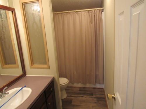 632 Shipper Road Lebanon, TN 37087 - Photo 11 of 11 a bathroom with a granite countertop sink and a mirror