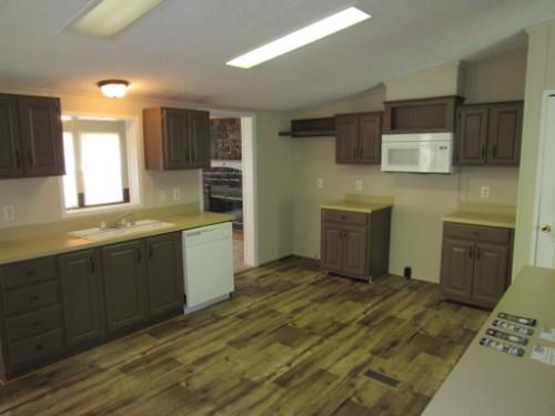 632 Shipper Road Lebanon, TN 37087 - Photo 5 of 11 a kitchen with stainless steel appliances granite countertop a sink and wooden cabinets