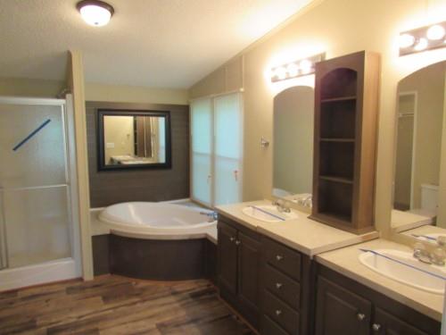 632 Shipper Road Lebanon, TN 37087 - Photo 10 of 11 a bathroom with a double vanity sink and mirror