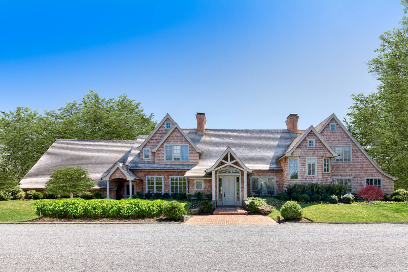 front view of a house with a yard