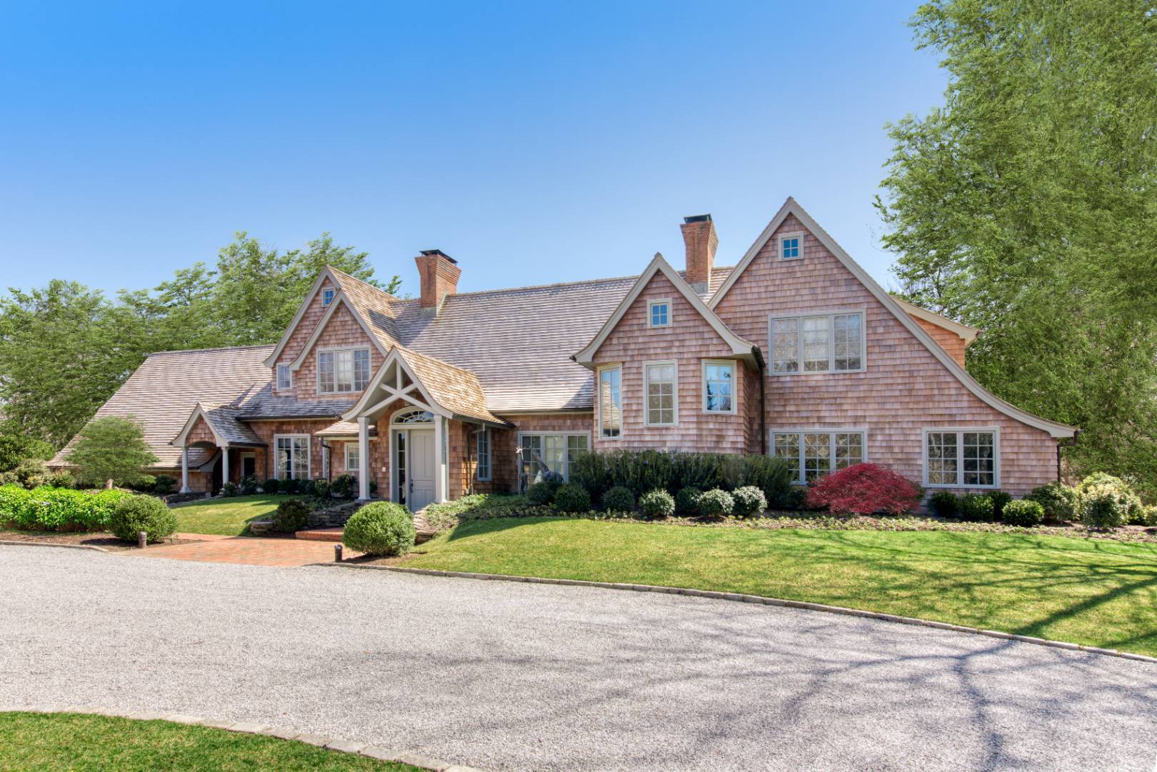 181 Parsonage Pond Road Sagaponack, NY 11962 - Photo 2 of 25 a front view of house with yard and green space