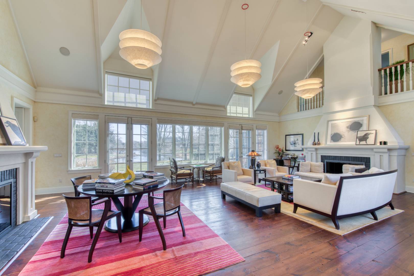 181 Parsonage Pond Road Sagaponack, NY 11962 - Photo 11 of 25 a living room with furniture a fireplace and a large window