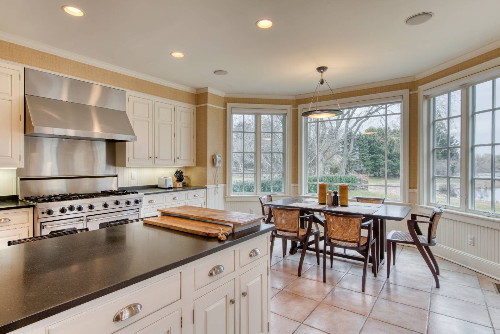 181 Parsonage Pond Road Sagaponack, NY 11962 - Photo 12 of 25 a kitchen with a stove a sink and a refrigerator