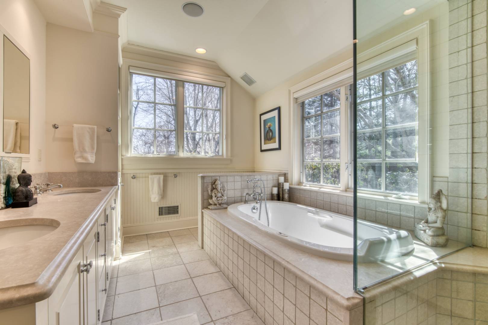 181 Parsonage Pond Road Sagaponack, NY 11962 - Photo 20 of 25 a bathroom with a sink a bathtub and next to a window
