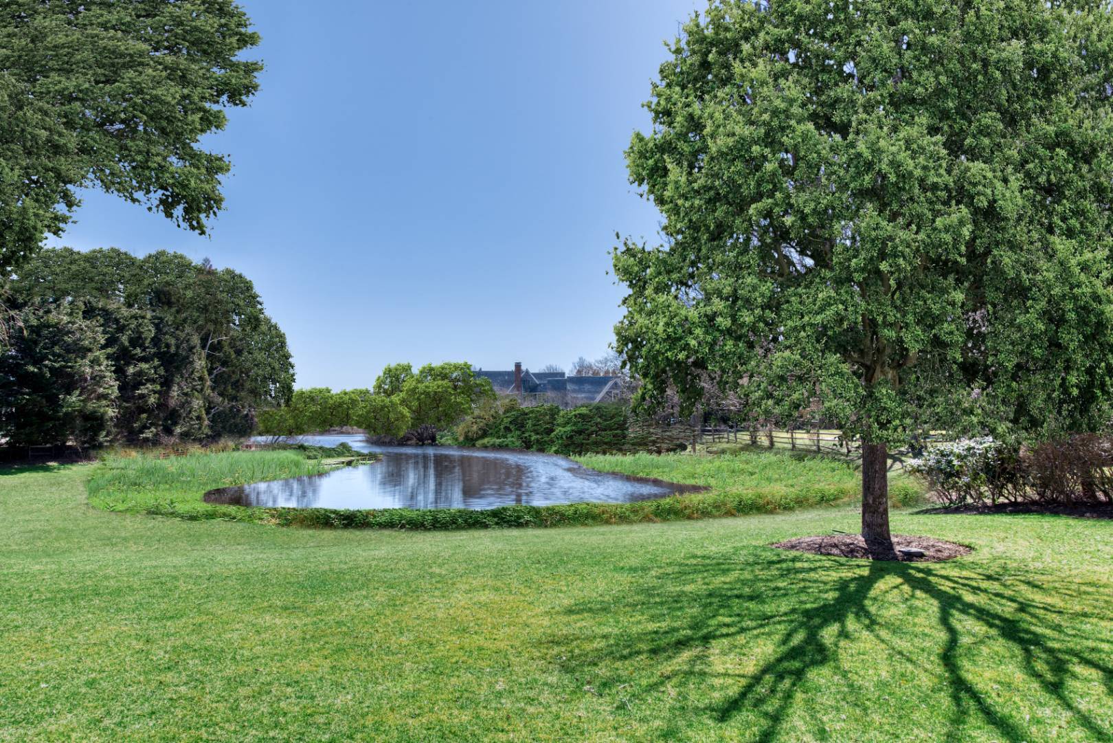 181 Parsonage Pond Road Sagaponack, NY 11962 - Photo 3 of 25 a backyard of a house with lots of green space