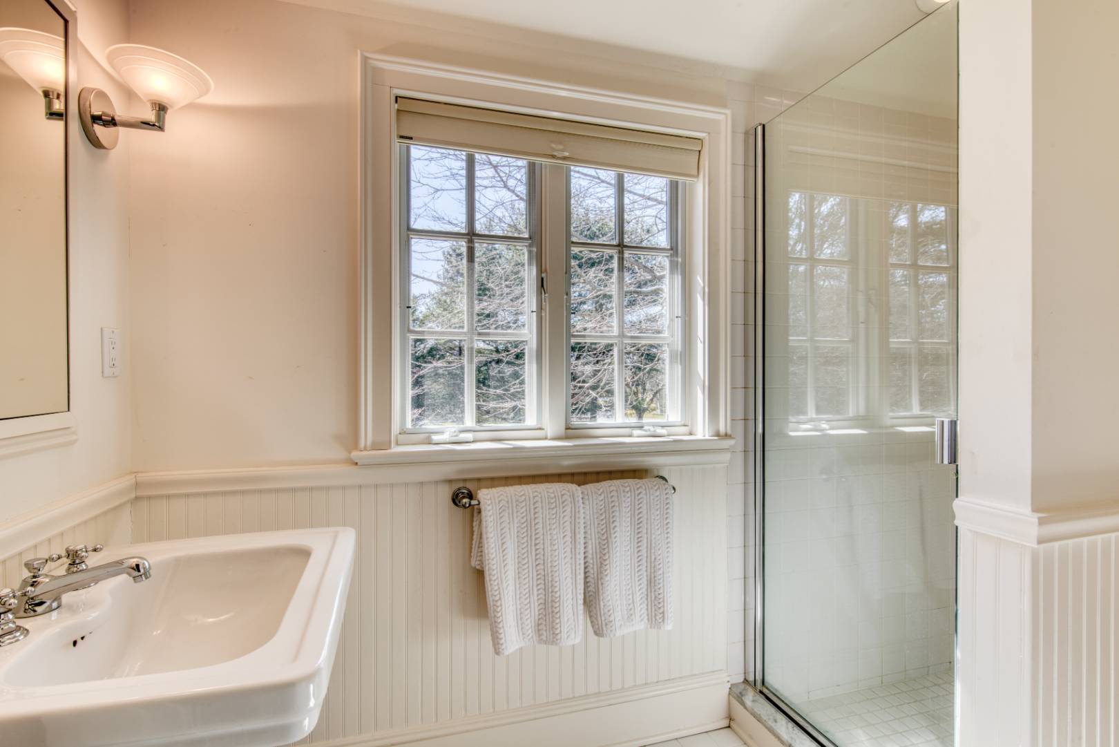 181 Parsonage Pond Road Sagaponack, NY 11962 - Photo 22 of 25 a bathroom with a sink a window and a shower