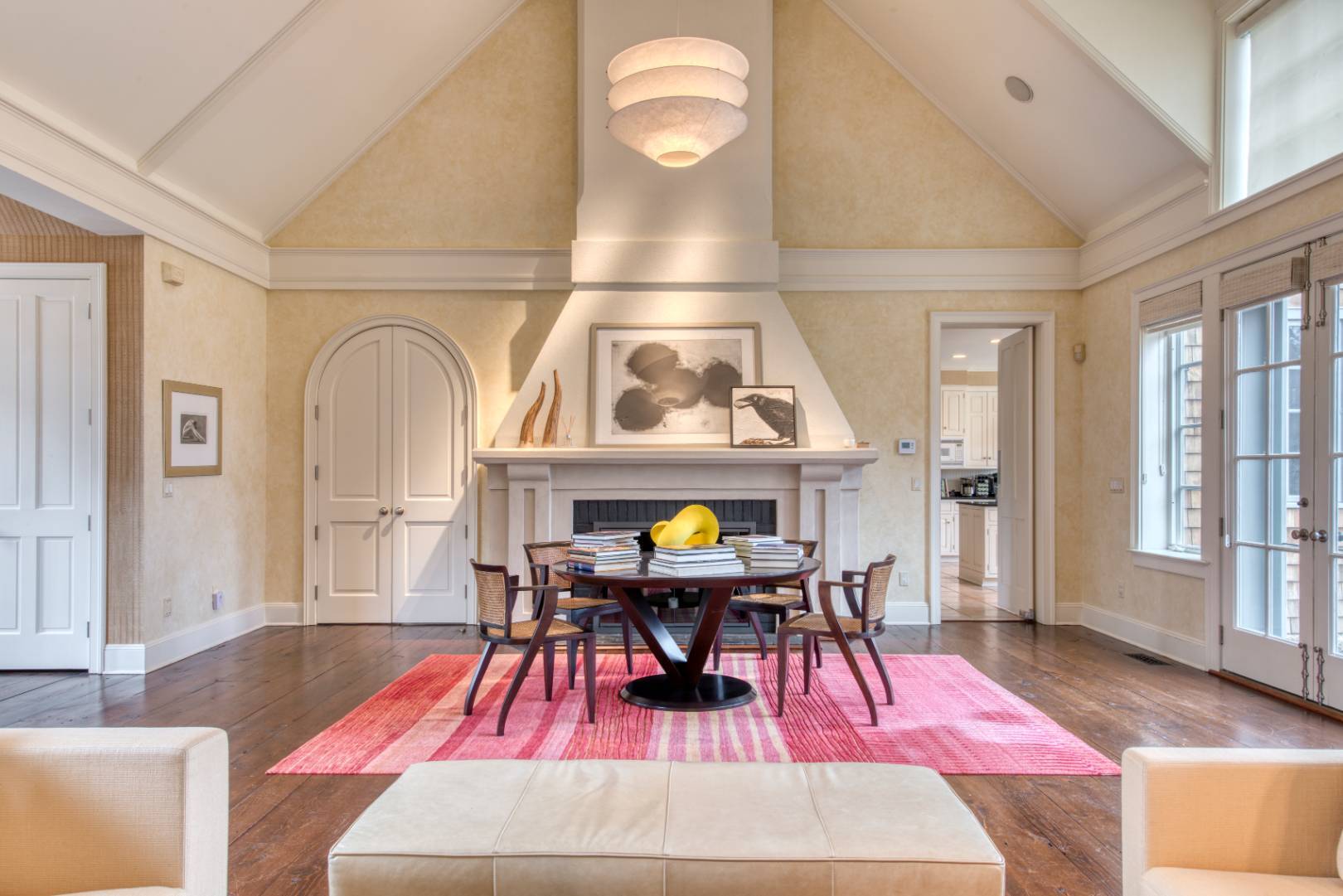 181 Parsonage Pond Road Sagaponack, NY 11962 - Photo 8 of 25 a living room with furniture a dining table and paintings on the wall with wooden floor