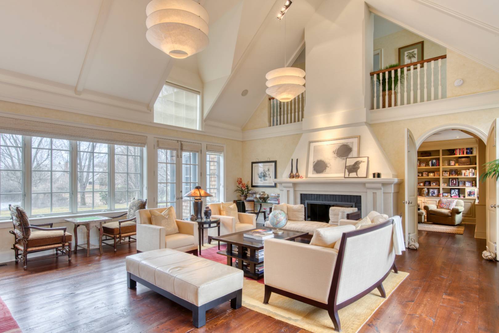 181 Parsonage Pond Road Sagaponack, NY 11962 - Photo 9 of 25 a living room with furniture fireplace and a large window