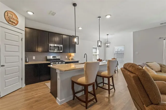 a dining room with furniture and window