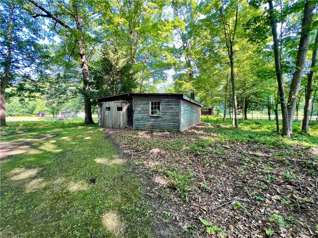 963 Kings Chapel Road New Castle, PA 16105 - Photo 13 of 27 a backyard of a house with lots of green space