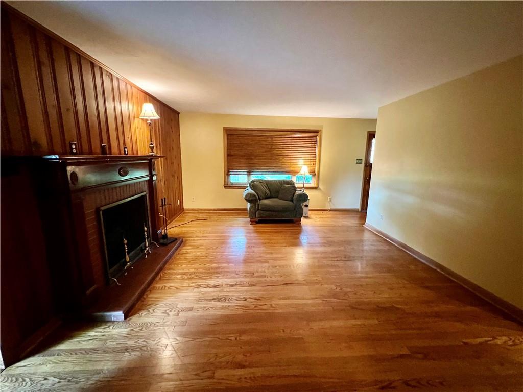 963 Kings Chapel Road New Castle, PA 16105 - Photo 17 of 27 a living room with furniture mirror and a fireplace