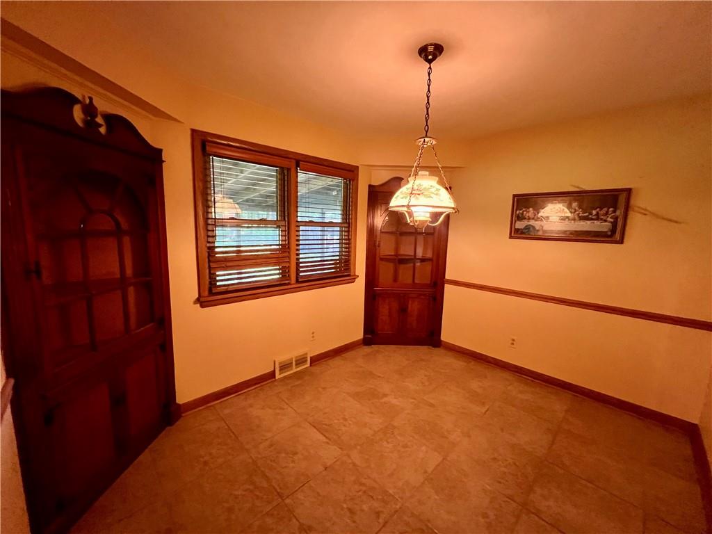 963 Kings Chapel Road New Castle, PA 16105 - Photo 18 of 27 a view of a room with window ceiling fan and refrigerator