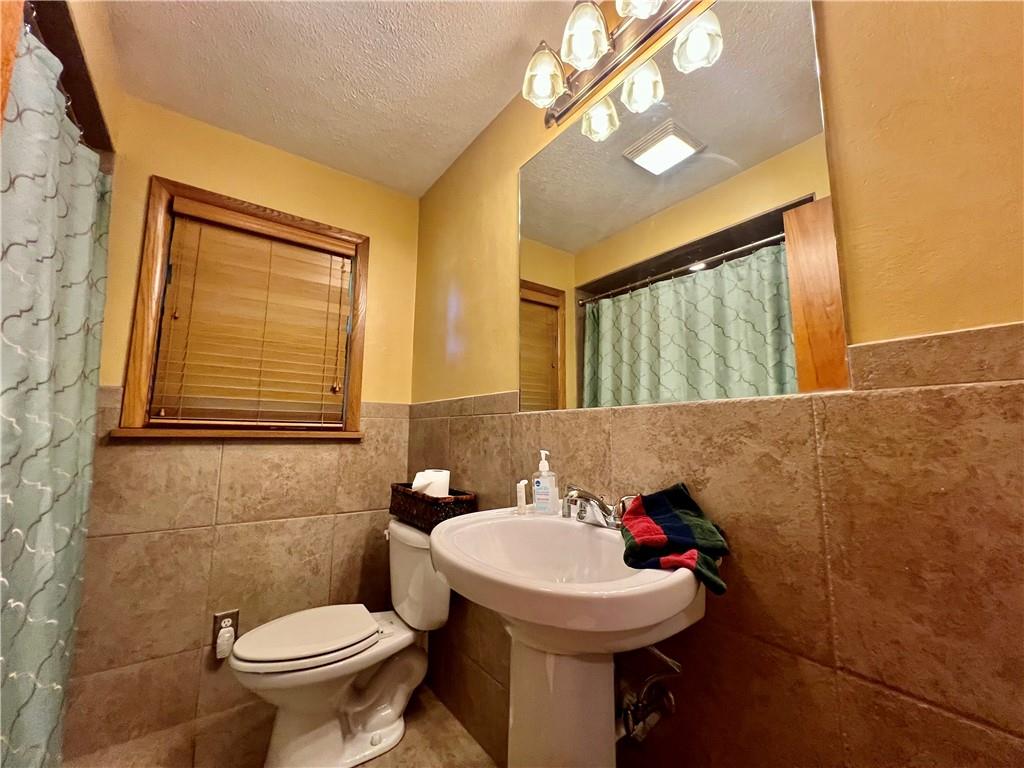 963 Kings Chapel Road New Castle, PA 16105 - Photo 24 of 27 a bathroom with a sink mirror and toilet
